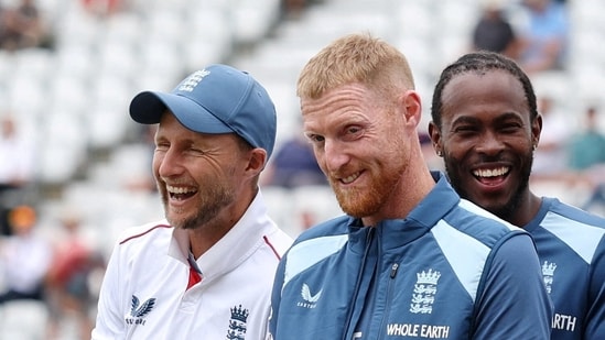 Ben Stokes and Joe Root react during the post match presentation ceremony.