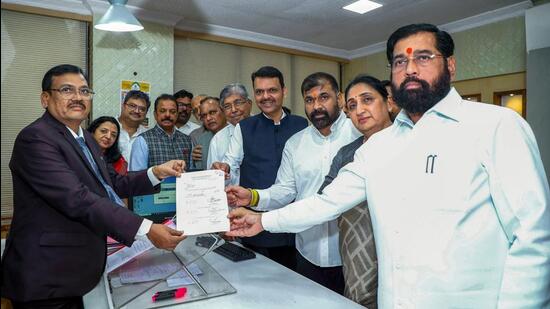 Sachin Ahir (left) joins the Eknath Shinde-led Shiv Sena in Mumbai on Tuesday. (ANI)