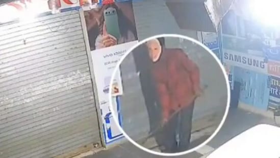 CCTV footage showed the man trying to break the lock of a mobile shop using an iron rod while wearing a mask commonly seen at political rallies featuring the prime minister's face. (X Video grab/ Desi Esco)