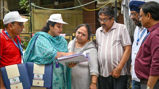 The exercise, which began across all 13 districts of the national capital, will continue till July 29, with BLOs visiting every household to distribute and collect enumeration forms as part of the revision exercise. (Sanchit Khanna/HT Photo)