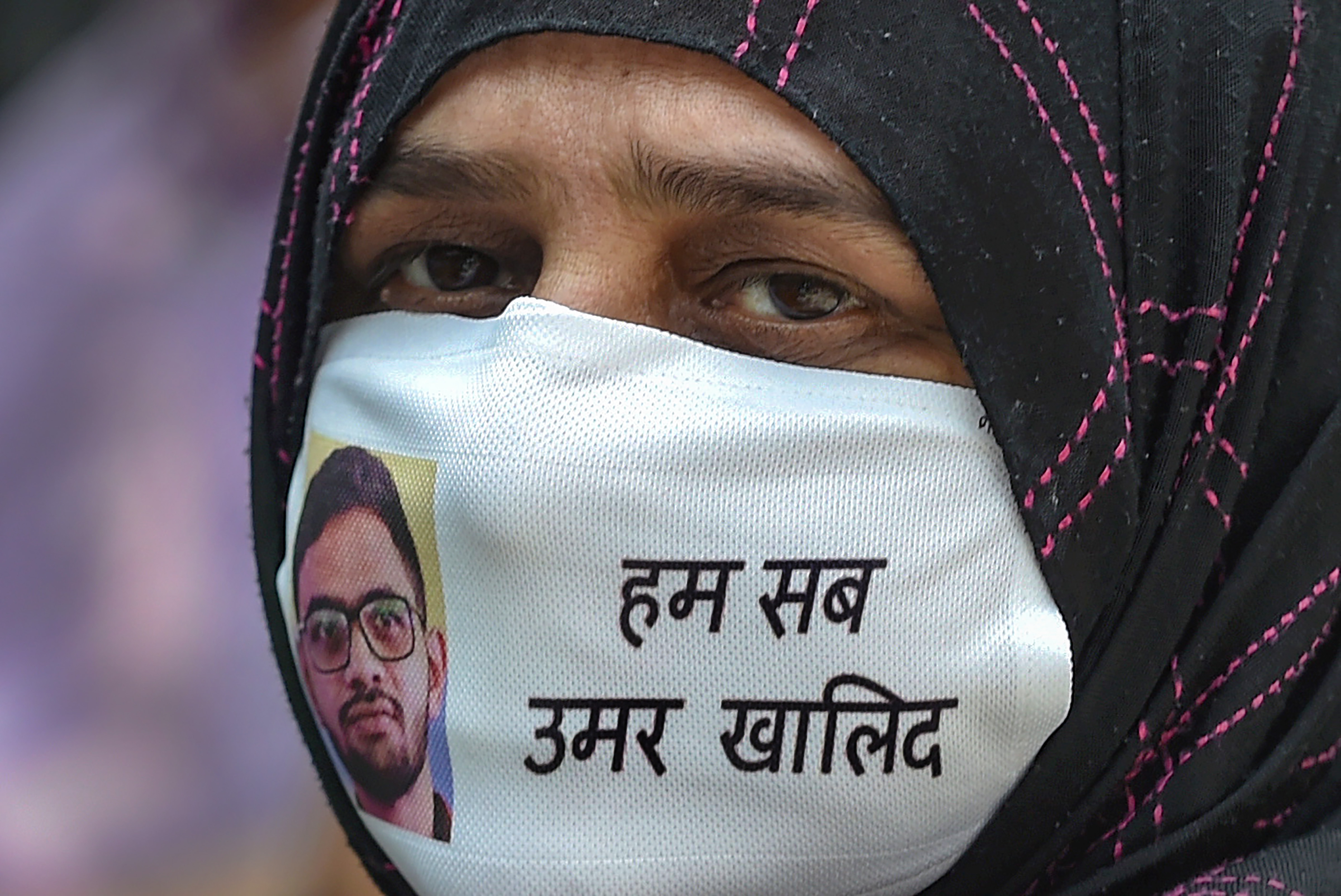 Sabiha, mother of Umar Khalid, is seen wearing a mask bearing her son's image during a press conference over police probe in the Delhi riots case. (PTI File Photo) Sabiha, mother of Umar Khalid, is seen wearing a mask bearing her son's image during a press conference over police probe in the Delhi riots case. (PTI File Photo)