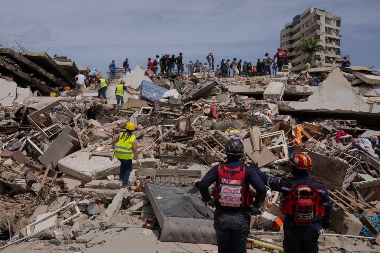 Residents, volunteers and rescue workers search for survivors in flattened buildings Sunday in La Guaira. Residents, volunteers and rescue workers search for survivors in flattened buildings Sunday in La Guaira.