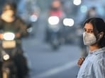 A commuter wears a mask during winter in 2025. (HT Archive)