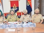 Amritsar commissioner of police Gurpreet Singh Bhullar (second from left) showing the seven pistols recovered from the two accused on Wednesday. (HT Photo)