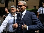 Chris Brown must pay $12.9 million to a housekeeper injured in a dog attack at his home.