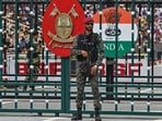 A Pakistani Ranger stands guard during the 'Beating Retreat' ceremony at the border gates of Pakistan and India at the Wagah border post. A Pakistani Ranger stands guard during the 'Beating Retreat' ceremony at the border gates of Pakistan and India at the Wagah border post.