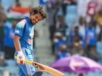 India's Ishan Kishan celebrates his century during an ODI cricket match between India and Afghanistan, in Lucknow