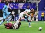 England's Harry Kane in action with DR Congo's Lionel Mpasi before a penalty claim is not given