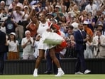 Serena Williams waves to the crowd after losing her first round match against Australia's Maya Joint at Wimbledon on Tuesday. (Reuters)
