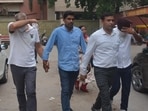 Two bank managers being produced in a court by CBI officials in Panchkula on Tuesday. (Sant Arora/HT)