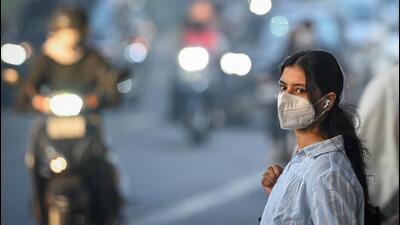 A commuter wears a mask during winter in 2025. (HT Archive) A commuter wears a mask during winter in 2025. (HT Archive)