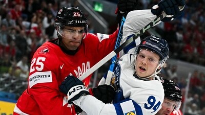 Canada's defender #25 Darnell Nurse (L) vies Finland's forward #94 Konsta Helenius during the IIHF Ice Hockey Men's World Championship semi-final match between Canada and Finland at the Swiss Life Arena in Zurich, on May 30, 2026. (AFP) Canada's defender #25 Darnell Nurse (L) vies Finland's forward #94 Konsta Helenius during the IIHF Ice Hockey Men's World Championship semi-final match between Canada and Finland at the Swiss Life Arena in Zurich, on May 30, 2026. (AFP)