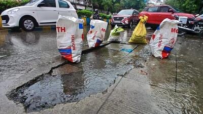 Thane, India - July -01, 2026: Following heavy rainfall in Thane, a portion of the road adjacent to a drainage chamber near the Three Petrol Pump area has caved in, resulting in a large pothole ,in Thane ,in Mumbai, India, on, Wednesday, July -01, 2026. ( photo by Praful Gangurde / Hindustan Times ) (praful Gangurde) Thane, India - July -01, 2026: Following heavy rainfall in Thane, a portion of the road adjacent to a drainage chamber near the Three Petrol Pump area has caved in, resulting in a large pothole ,in Thane ,in Mumbai, India, on, Wednesday, July -01, 2026. ( photo by Praful Gangurde / Hindustan Times ) (praful Gangurde)