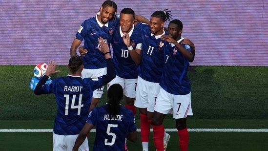 France's forward #10 Kylian Mbappe celebrates scoring his team's third goal with teammates during the 2026 World Cup round of 32 football match between France and Sweden (AFP)