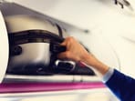 A compact cabin suitcase packed efficiently for an IndiGo flight, ready to skip check-in queues and baggage claim with ease. (canva.com)