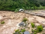 Debris and mud flow across an area after heavy rainfall triggered flash floods, at Gandoh in Doda district of Jammu and Kashmir, on Wednesday. (PTI)