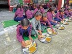 Government school students having mid day meal during the school hours in Ludhiana. (HT Photo)