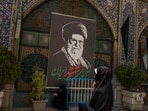 A banner depicting Iran's late Supreme Leader Ayatollah Ali Khamenei, ahead of his farewell ceremony, in a mosque in Tehran, Iran