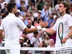 Serbia's Novak Djokovic shakes hands with Greece's Stefanos Tsitsipas after the match.