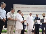 The MoU was signed by NDRI director Dheer Singh and superintendent of Karnal District Jail Lakhbir Singh Brar, in the presence of Rajya Sabha MP Sanjay Bhatia on the 104th Foundation Day of the institute. (HT Photo)
