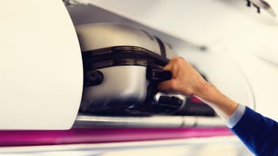 A compact cabin suitcase packed efficiently for an IndiGo flight, ready to skip check-in queues and baggage claim with ease. (canva.com)