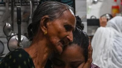 Mumbai, India. July 02, 2026 - Badrunisa, Aslam Shaikh's sister and his daughter, Shabnam, mourned his passing. Aslam Shaikh, a 55-year-old Sakinaka resident, died after falling into an open manhole during maintenance work on Khairani Road, Sakinaka, Mumbai. India. July 2, 2026. (Photo by Raju Shinde/HT Photo) (Raju Shinde) Mumbai, India. July 02, 2026 - Badrunisa, Aslam Shaikh's sister and his daughter, Shabnam, mourned his passing. Aslam Shaikh, a 55-year-old Sakinaka resident, died after falling into an open manhole during maintenance work on Khairani Road, Sakinaka, Mumbai. India. July 2, 2026. (Photo by Raju Shinde/HT Photo) (Raju Shinde)