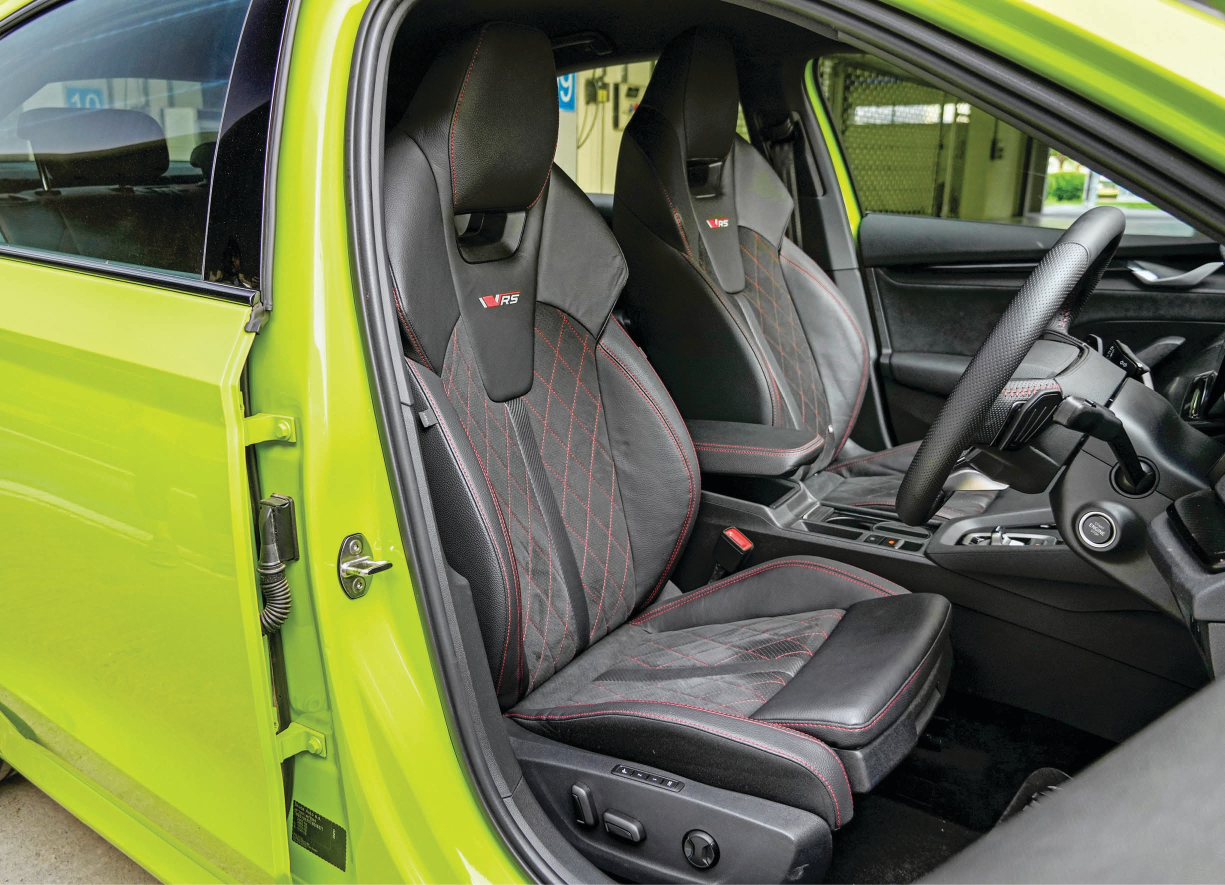 Inside, suede, contrast stitching and a carbon-fibre set a sporty tone. Inside, suede, contrast stitching and a carbon-fibre set a sporty tone.