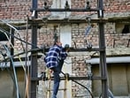 A lineman restoring electricity in Ludhiana on Thursday. (Gurpreet Singh/HT)