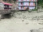 A view of scattered debris at the irrigation bridge in the Rip Tejer area after heavy rains caused flooding in canals, in Kinnaur on Thursday. (ANI Video Grab) A view of scattered debris at the irrigation bridge in the Rip Tejer area after heavy rains caused flooding in canals, in Kinnaur on Thursday. (ANI Video Grab)