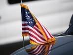 An America 250 flag is seen on the hood of a vehicle ahead of the US Independence Day on July 4.