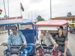 E-rickshaw drivers wait for passengers at a stand in New Delhi. (Bloomberg File)