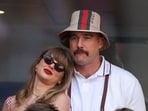 Taylor Swift vs Travis Kelce net worth (Photo by CHARLY TRIBALLEAU / AFP)