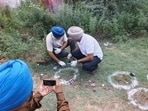 Forensic team investigating the site after encounter of Jalandhar-based gangsters of Goldy Dhillon gang on Patiala-Sangrur bypass near Ramgarh village in Patiala on Thursday. (ANI)