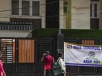 People walk past a banner of the rebel faction of Trinamool Congress (TMC) displayed outside the Trinamool Bhavan, in Kolkata, West Bengal. 