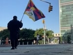 A man identified by Voice of Tibet, a media outlet of exiled Tibetans, as Tibetan activist Lobga Rangzen, walks carrying a Tibetan flag near the United Nations headquarters, before setting himself on fire in an appeal for Tibetan independence, in New York, U.S, July 2, 2026.