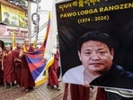 Tibetan community members participate in a march in memory of Tibetan activist Lobga Rangzen, who passed away after self-immolation in New York, in Mcleodganj, Himachal Pradesh.