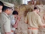 Police search for cash in a haystack in Ayodhya’s Rudauli. (SOURCED)