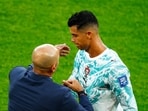 Portugal's Cristiano Ronaldo with coach Roberto Martinez after he was substituted. 