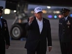 US President Donald Trump gestures toward reporters after disembarking from Air Force One at Joint Base Andrews, Maryland on July 1, 2026. 