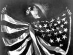 Untitled - Man With Flag by artist David Hammons (1943-). How real is the struggle? On just  one parameter, US Federal Reserve and census data indicates that about 44% of  Blacks live in a home their family owns, compared to 73% of non-Hispanic Whites. (Glenstone Museum)
