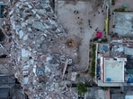 A drone view shows rescuers working at the site of collapsed buildings, in the aftermath of earthquakes, in La Guaira, Venezuela, July 2, 2026.(REUTERS)