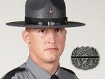 Police Trooper Mike Pahira was killed on July 1 during a truck inspection when another truck crashed into his patrol vehicle. The driver, Michael Bon, faces serious charges, while tributes highlight Pahira's nearly two decades of service and dedication to public safety.