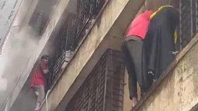 Smoke traps dozens as fire tears through Andheri rehab building; residents break window grilles to rescue families Smoke traps dozens as fire tears through Andheri rehab building; residents break window grilles to rescue families