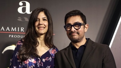 Mumbai: Bollywood actor Aamir Khan, right, with his partner Gauri Spratt, during a celebration marking 25 years of Aamir Khan Productions, in Mumbai, Maharashtra, late Saturday, June 13, 2026. (PTI Photo) (PTI)