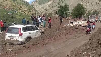 The two vehicles that were trapped in debris after a flashflood triggered a landslide near Choling in Kinnaur district on Friday. (HT Photo) The two vehicles that were trapped in debris after a flashflood triggered a landslide near Choling in Kinnaur district on Friday. (HT Photo)
