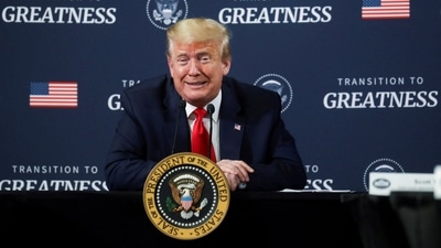 US President Donald Trump reacts as he holds a "listening session" meeting with members of the local African American business community during a visit to the Ford Rawsonville Components Plant in Ypsilanti, Michigan. (REUTERS)