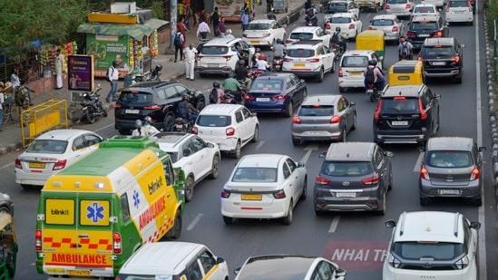 How walkable is Delhi? Shops, stalls, trees, poles on Lajpat Nagar footpaths
