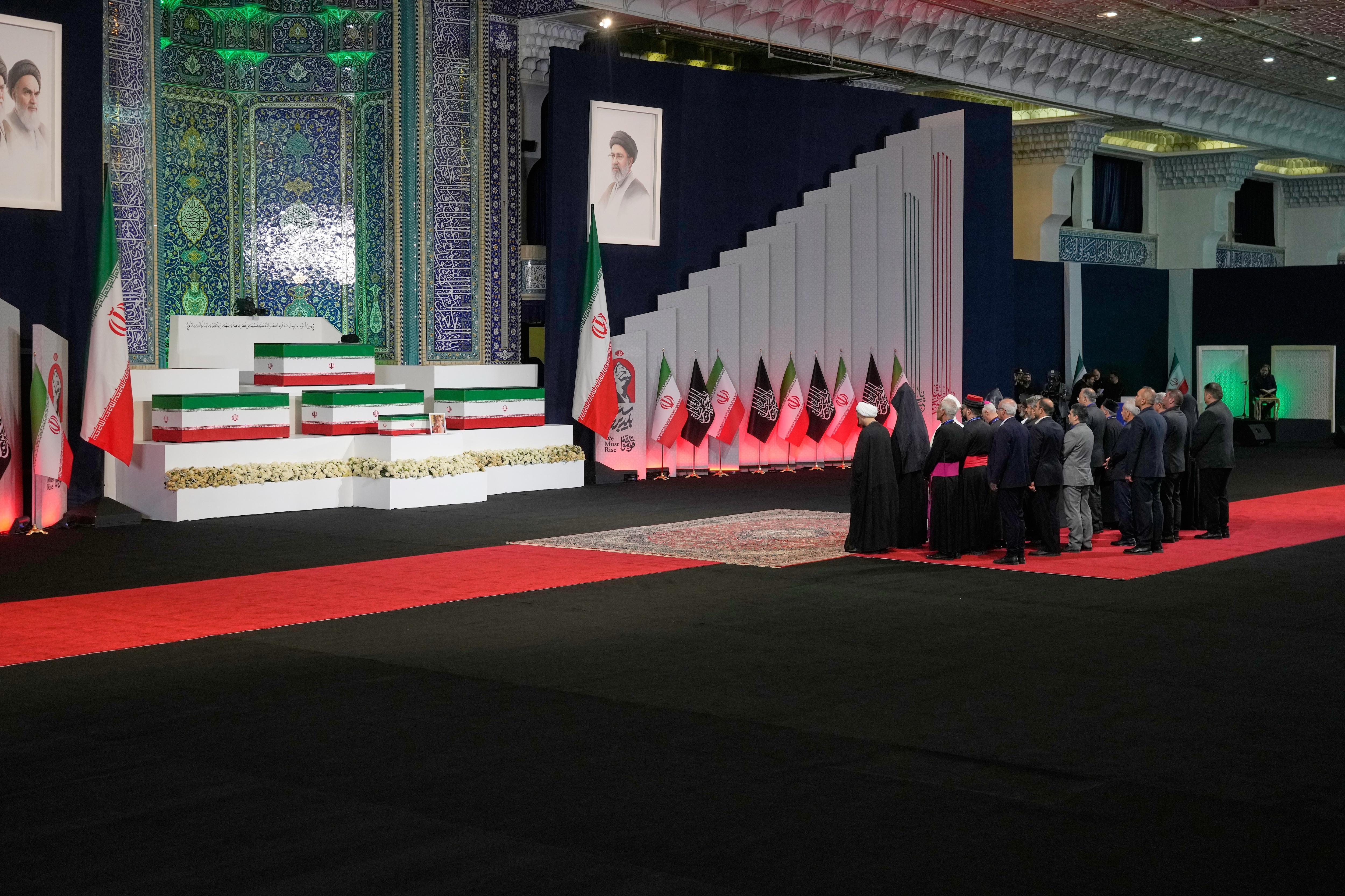 Foreign religious leaders and other mourners pay their respects before the coffins of slain Iranian Supreme Leader Ayatollah Ali Khamenei and members of his family. (AP Photo) Foreign religious leaders and other mourners pay their respects before the coffins of slain Iranian Supreme Leader Ayatollah Ali Khamenei and members of his family. (AP Photo)