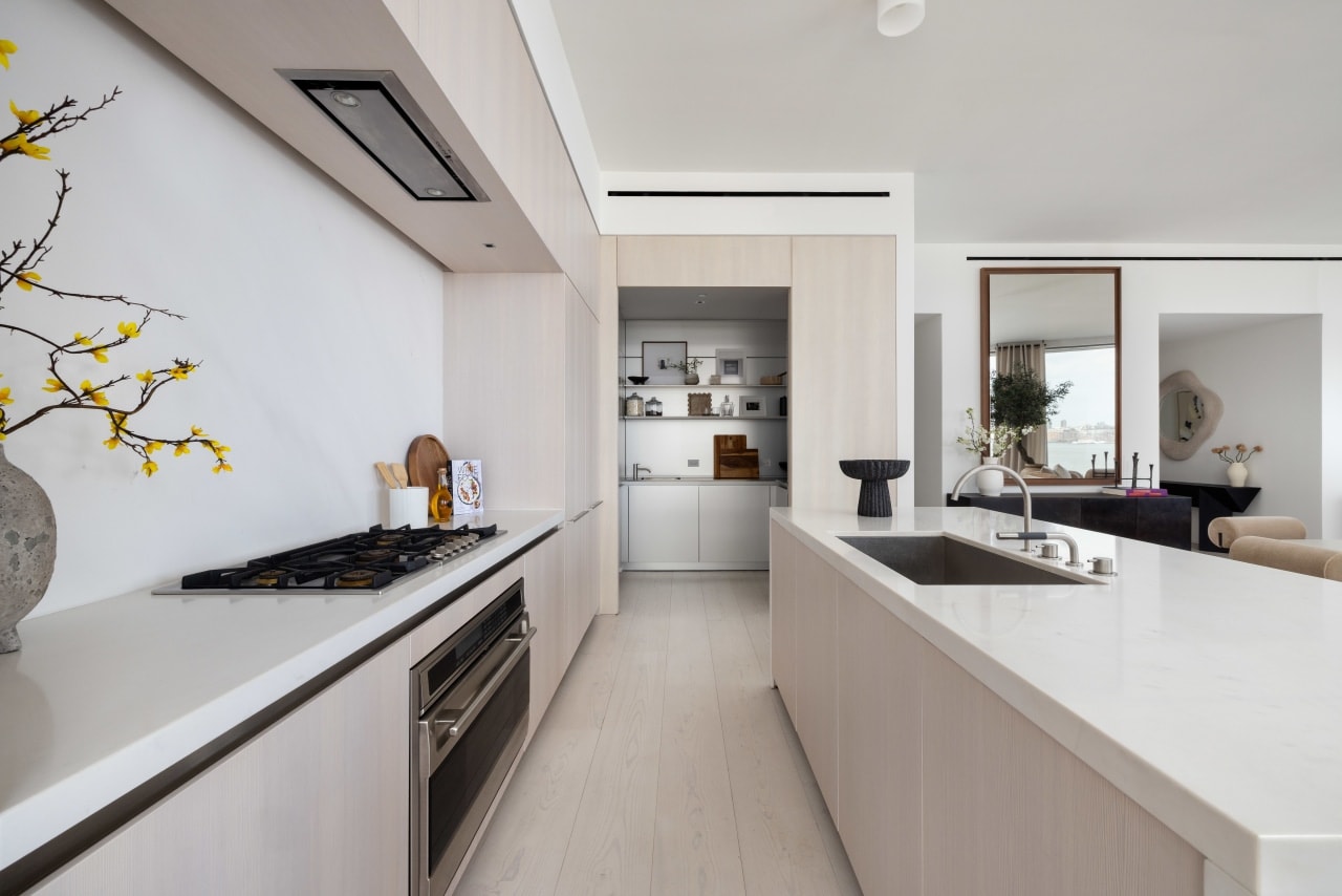 The condo has wide-plank Scandinavian larch wood floors.