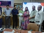 Ahead of the scheme’s launch, French Embassy officials handed over certificates to 26 government school teachers at a function in Gurugram on Friday. (HT Photo)